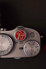 Load image into Gallery viewer, Silver Red Fuji Soft Release Button - Hyperion Handmade Camera Straps