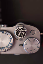 Load image into Gallery viewer, Silver Fuji Soft Release Button - Hyperion Handmade Camera Straps
