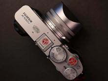 Load image into Gallery viewer, Silver Red Fuji Soft Release Button - Hyperion Handmade Camera Straps
