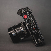 Load image into Gallery viewer, Black Hot Shoe Cover Red X - Hyperion Handmade Camera Straps

